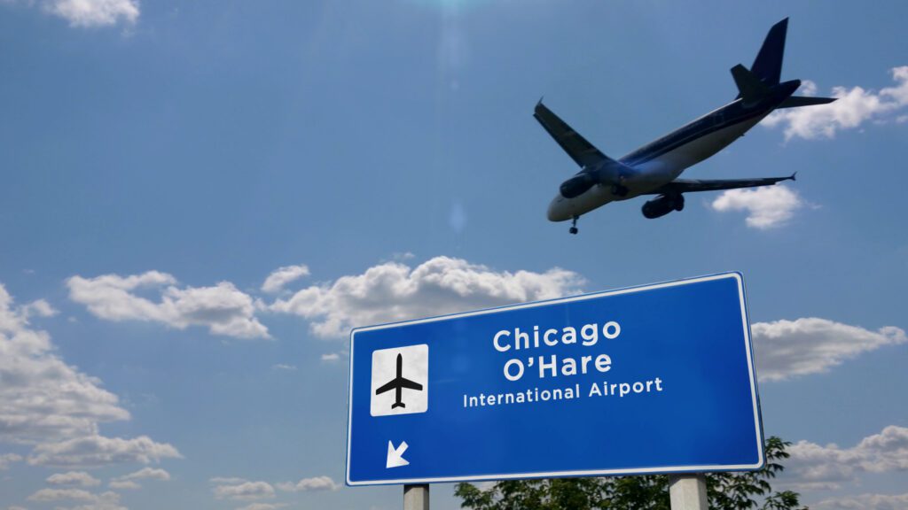 O'hare International Airport Construction Cost Estimating. Airplane flying overhead.